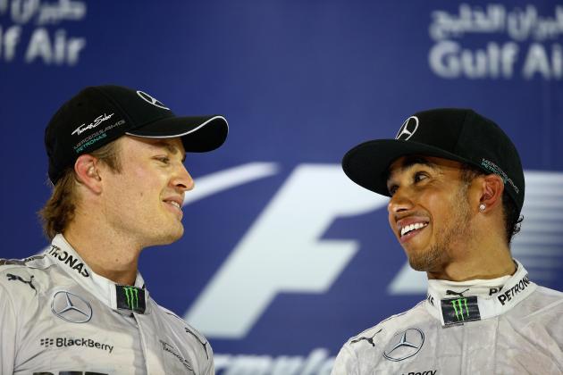 SAKHIR, BAHRAIN - APRIL 06:  Race winner Lewis Hamilton (R) of Great Britain and Mercedes GP and second placed team mate Nico Rosberg (L) of Germany and Mercedes GP celebrate on the podium following the Bahrain Formula One Grand Prix at the Bahrain International Circuit on April 6, 2014 in Sakhir, Bahrain.  (Photo by Clive Mason/Getty Images)