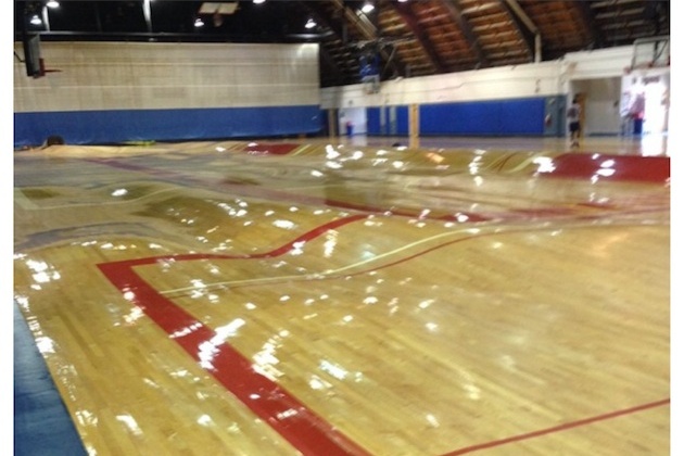 Pipes Burst Underneath Basketball Court Warping Wood To The