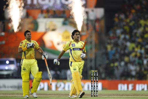 Chennai Super Kings' captain Mahendra Singh Dhoni, right, and teammate Suresh Raina leave the ground at the end of the innings during their Indian Premier League (IPL) final cricket match against Kolkata Knight Riders in Chennai, India, Sunday, May 27, 2012.  (AP Photo/Aijaz Rahi)