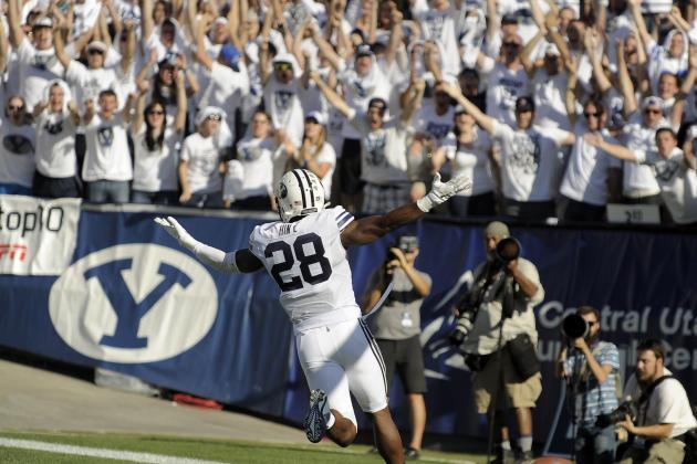PROVO, UT - SEPTEMBER 20: Running back Adam Hine #28 of the Brigham Young Cougars celebrates his 100 yard kickoff return for a fourth quarter touchdown against the Virginia Cavaliers, during their game at LaVell Edwards Stadium on September 20, 2014 in Provo, Utah. BYU won 41-33. (Photo by Gene Sweeney Jr/Getty Images )