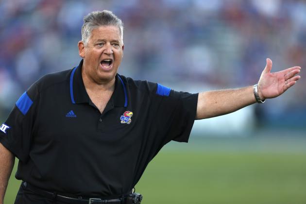 Kansas head coach Charlie Weis argues with an official after a penalty was called on his team during a game against Southeast Missouri State in the second quarter of an NCAA football game Saturday, Sept. 6, 2014, in Lawrence, Kan. (AP Photo/Ed Zurga)