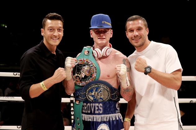 LONDON, ENGLAND - SEPTEMBER 20: George Groves celebrates his victory over Christopher Rebrasse with Arsenal's Mezut Ozil and Lukas Podolski during their WBC Final Eliminator & European Super Middleweight bout at Wembley Arena on September 20, 2014 in London, England. (Photo by Scott Heavey/Getty Images)