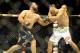 Johny Hendricks, left, lands a punch on Robbie Lawler during a UFC 171 mixed martial arts welterweight title bout, Saturday, March 15, 2014, in Dallas. Hendricks won by decision. (AP Photo/Matt Strasen)