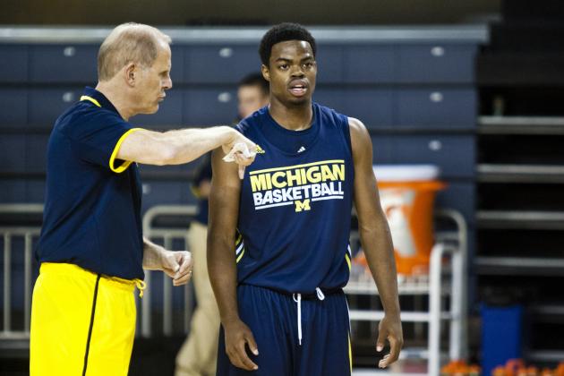 Michigan head coach John Beilein, left, gives direction to freshman guard Derrick Walton Jr. during a practice session after NCAA college basketball media day on Thursday, Oct. 24, 2013, in Ann Arbor, Mich. (AP Photo/Tony Ding)