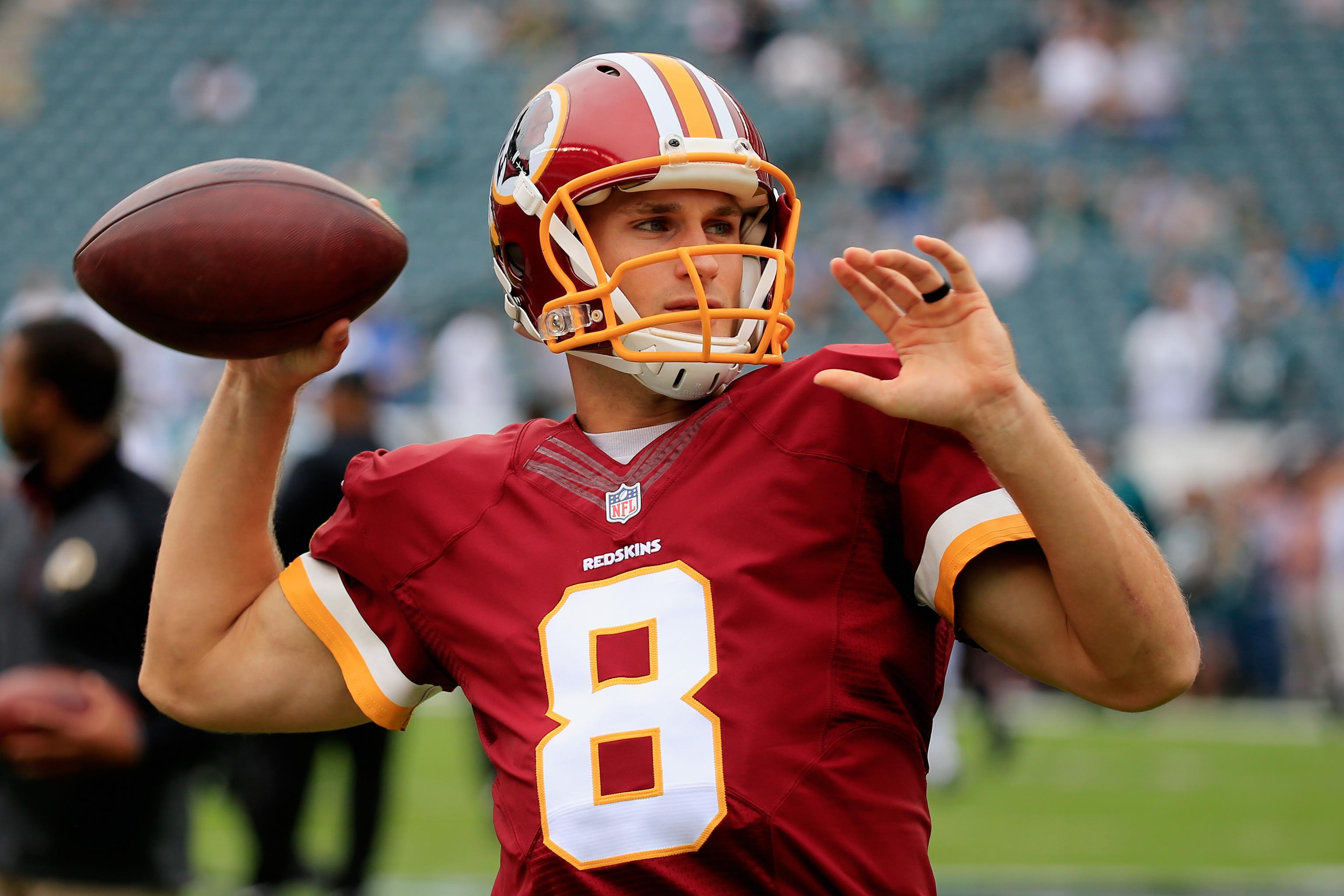 Washington Redskins quarterback Kirk Cousins (8) looks for wide