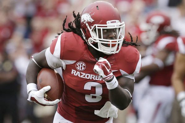 Arkansas running back Alex Collins runs for a touchdown in the first quarter of an NCAA college football game against Nicholls in Fayetteville, Ark., Saturday, Sept. 6, 2014. (AP Photo/Danny Johnston)