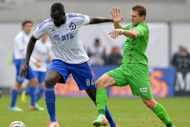 KHIMKI, RUSSIA - MARCH 23: Christopher Samba (L) of FC Dinamo Moscow challenged by Aleksandr Prudnikov of FC Rubin Kazan during the Russian Premier League match between FC Dinamo Moscow and FC Rubin Kazan at the Arena Khimki Stadium on March 23, 2014 in Khimki, Russia. (Photo by Epsilon/Getty Images)