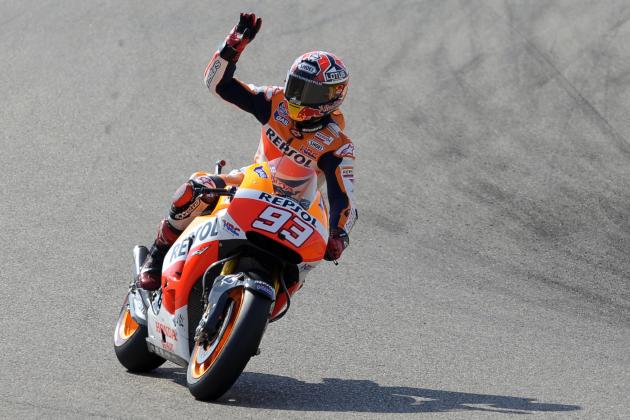Spain's rider Marc Marquez waves to the crowd after a second free practice at the Motorland racetrack in Alcaniz, Spain, Friday, Sept. 26, 2014. The Aragon Motorcycle Grand Prix will take place Sunday. (AP Photo/Manu Fernandez)