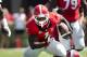 DUPLICATE***Georgia running back Sony Michel (1) gets past Troy defensive back Montres Kitchens (1) in the first half of an NCAA college football game Saturday, Sept. 20, 2014, in Athens, Ga. (AP Photo/John Bazemore)
