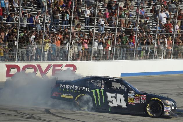 Kyle Busch does a burnout after he won the NASCAR Nationwide series auto race, Saturday, Sept. 27, 2014, at Dover International Speedway in Dover, Del. (AP Photo/Nick Wass)