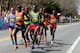 Elite runners lead by Dennis Kimetto, of Kenya, and Markos Geneti, of the United States, pass Wellesley College during the 118th Boston Marathon Monday, April 21, 2014 in Wellesley. (AP Photo/Mary Schwalm)