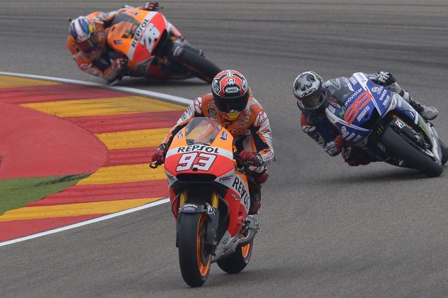 MotoGP raider Marc Marquez of Spain steers his motorcycle followed by Jorge Lorenzo and Dani Pedrosa during the MotoGP race at the Aragon Motorcycle Grand Prix in Alcaniz, Spain, Sunday, Sept. 28, 2014. (AP Photo/Manu Fernandez)