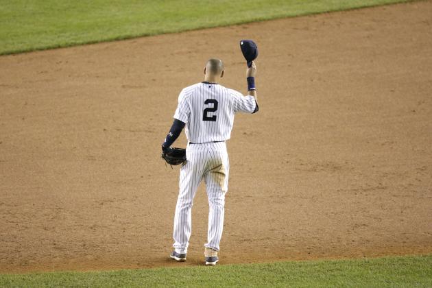 New York Yankees shortstop Derek Jeter waves to fans as he walks around the infield after driving in the winning run against the Baltimore Orioles in the ninth inning of a baseball game, Thursday, Sept. 25, 2014, in New York. The game, which the Yankees won 6-5, was Jeter's last home game of his career. (AP Photo/Bill Kostroun)