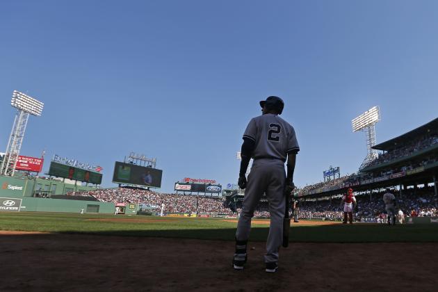 New York Yankees designated hitter Derek Jeter stands on deck for his at-bat in the first inning against the Boston Red Sox in a baseball game at Fenway Park Sunday, Sept. 28, 2014, in Boston. It is the last baseball game of his career. (AP Photo/Elise Amendola)