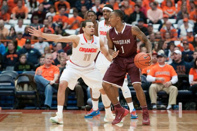 Nov 12, 2013; Syracuse, NY, USA; Fordham Rams guard Mandell Thomas (1) is defended by Syracuse Orange guard Tyler Ennis (11) during the second half of a game at the Carrier Dome. Syracuse won the game  89-74. Mandatory Credit: Mark Konezny-USA TODAY Sports