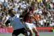 Cesena's Francesco Renzetti, left, vies for the ball with AC Milan's Keisuke Honda of Japan, during their Serie A soccer match at Cesena's Manuzzi stadium, Italy, Sunday, Sept. 28, 2014. (AP Photo/Marco Vasini)