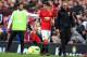 MANCHESTER, ENGLAND - SEPTEMBER 27: Ander Herrera of Manchester United is consoled by teammate Juan Mata of Manchester United after being substituted in the second half during the Barclays Premier League match between Manchester United and West Ham United at Old Trafford on September 27, 2014 in Manchester, England. (Photo by Laurence Griffiths/Getty Images)
