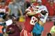 KANSAS CITY, MO - SEPTEMBER 29: Travis Kelce #87 of the Kansas City Chiefs completes a pass against the New England Patriots at Arrowhead Stadium on September 29, 2014 in Kansas City, Missouri. (Photo by Peter Aiken/Getty Images)