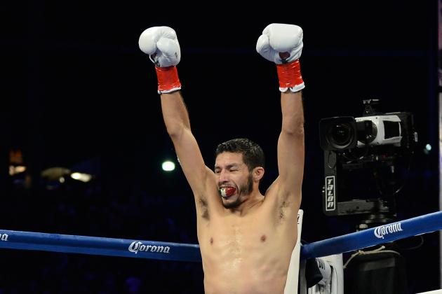 CARSON, CA - AUGUST 24:  Jhonny Gonzalez reacts to his first round knockout of Abner Mares during the WBC Featherweight Title Fight at the StubHub Center on August 24, 2013 in Carson, California.  (Photo by Harry How/Getty Images)