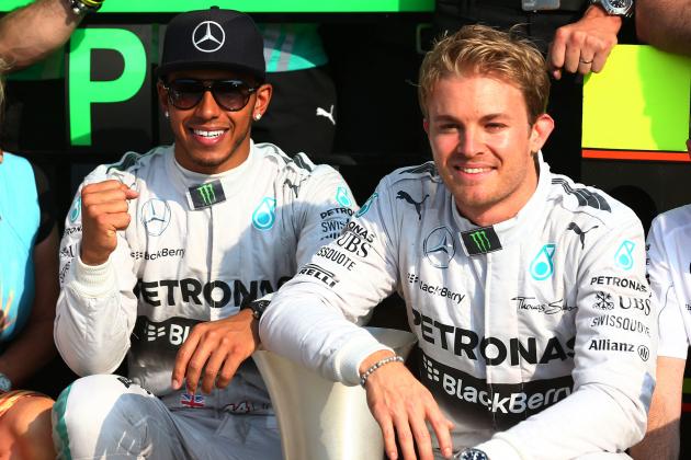 MONZA, ITALY - SEPTEMBER 07:  (L-R) Race winner Lewis Hamilton of Great Britain and Mercedes GP and second placed Nico Rosberg of Germany and Mercedes GP celebrate following the F1 Grand Prix of Italy at Autodromo di Monza on September 7, 2014 in Monza, Italy.  (Photo by Mark Thompson/Getty Images)