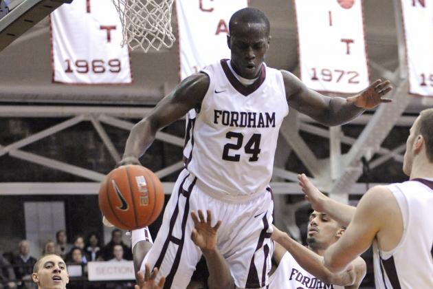 Fordham's Bryan Smith (24) fouls Harvard's Wesley Saunders as Smith lands on his shoulders during the first half of an NCAA college basketball game Tuesday, Jan. 3, 2012, in New York. (AP Photo/Bill Kostroun)