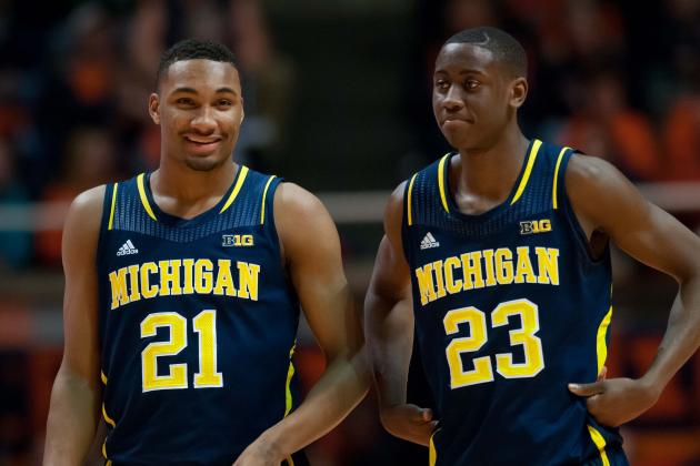 Mar 4, 2014; Champaign, IL, USA;  Michigan Wolverines guard Zak Irvin (21) and Michigan Wolverines guard Caris LeVert (23) during the second half against the Illinois Fighting Illini at State Farm Center.  Michigan defeated Illinois 84-53.  Mandatory Credit: Bradley Leeb-USA TODAY Sports