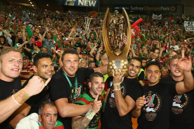 SYDNEY, AUSTRALIA - OCTOBER 05:  The Rabbitohs pose with the trophy in front of the crowd after victory during the 2014 NRL Grand Final match between the South Sydney Rabbitohs and the Canterbury Bulldogs at ANZ Stadium on October 5, 2014 in Sydney, Australia.  (Photo by Mark Kolbe/Getty Images)