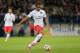 Paris Saint Germain's forward Lucas Moura of Brazil run with the ball on the field during his League One soccer match against Caen, in Caen, western France, Wednesday, Sept. 24, 2014. (AP Photo/David Vincent)