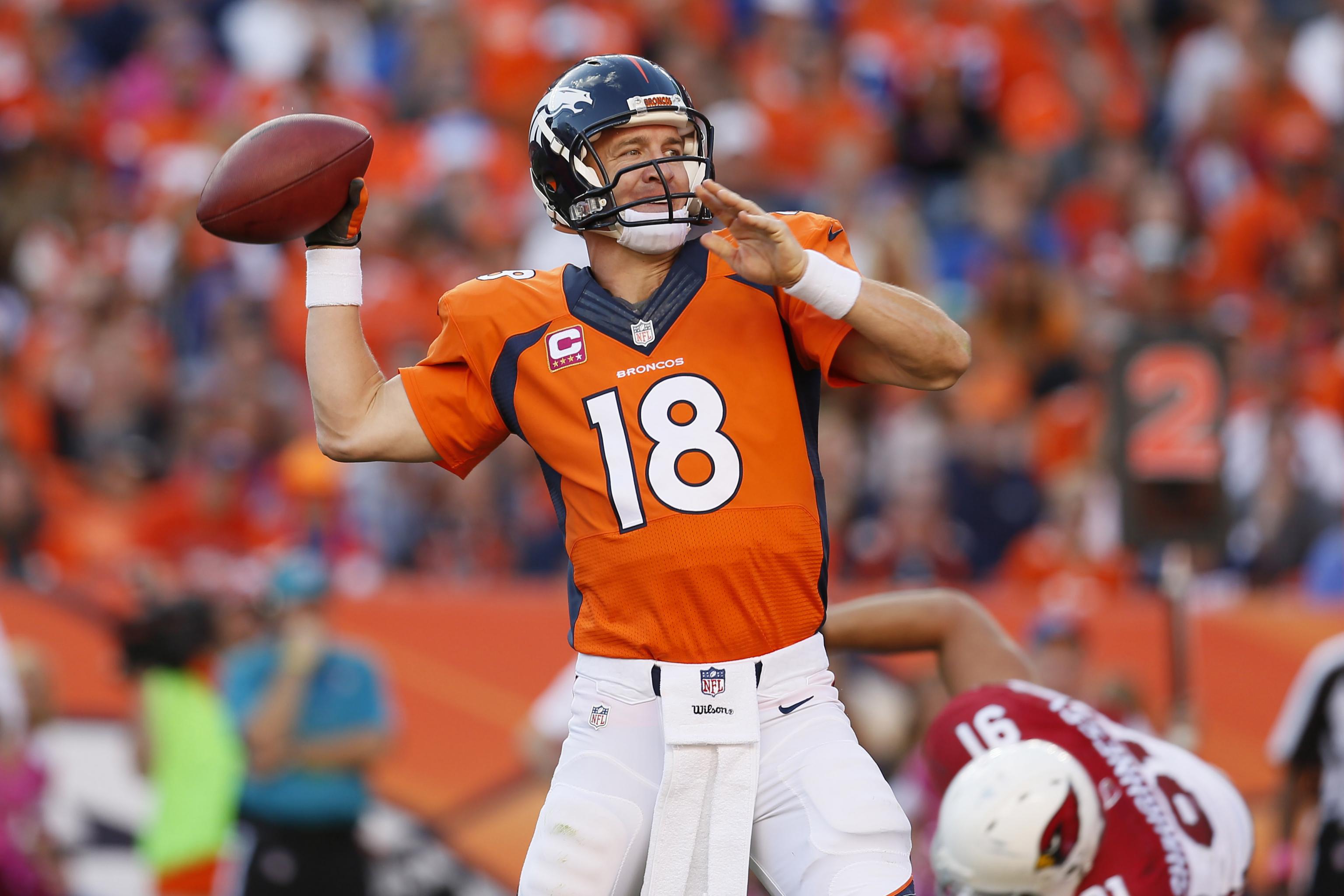 Denver Broncos quarterback Peyton Manning (18) watches a replay