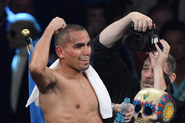 LAS VEGAS, NV - SEPTEMBER 14:  Carlos Molina celebrates his split-decision victory over Ishe Smith in their IBF junior middleweight title fight at the MGM Grand Garden Arena on September 14, 2013 in Las Vegas, Nevada.  (Photo by Ethan Miller/Getty Images)