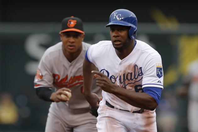 Kansas City Royals' Lorenzo Cain (6) get caught in a rundown between Baltimore Orioles second baseman Jonathan Schoop, back, and third baseman Manny Machado during the second inning of a baseball game at Kauffman Stadium in Kansas City, Mo., Saturday, May 17, 2014. Cain was tagged out by Machado. (AP Photo/Orlin Wagner)