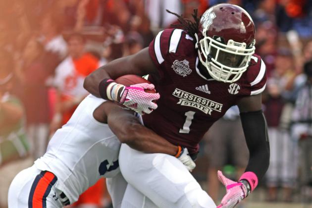 Mississippi State wide receiver De'Runnya Wilson (1) drags Auburn defensive back Jonathan Jones (3) over the goal line during the first half of an NCAA college football game in Starkville, Miss., Saturday, Oct. 11, 2014. (AP Photo/Jim Lytle)