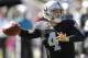 Oakland Raiders quarterback Derek Carr (4) passes against the San Diego Chargers during the second quarter of an NFL football game in Oakland, Calif., Sunday, Oct. 12, 2014. (AP Photo/Ben Margot)