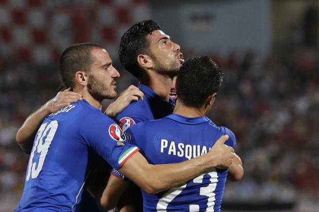 Italy’s Graziano Pelle, center, celebrates with his teammates Leonardo Bonucci, left, and Manuel Pasqual after scoring  celebrates after scoring during the Euro 2016 qualifying soccer match between Malta and Italy, at the National Stadium Ta' Qali, in Valletta, Malta, Monday, Oct. 13, 2014. (AP Photo/Antonio Calanni)