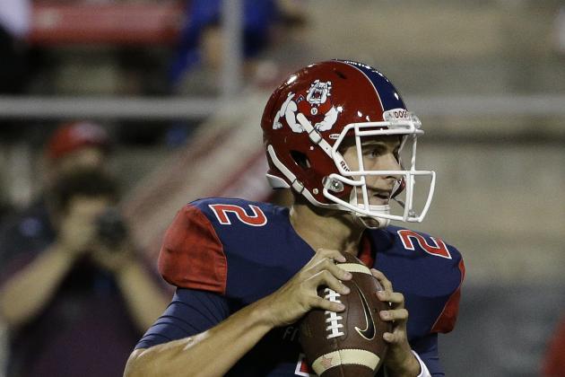 Fresno State Bulldogs quarterback Brian Burrell (2) drops back for a pass against the UNLV Rebels during an NCAA college football game Friday, Oct. 10, 2014, in Las Vegas. (AP Photo/John Locher)
