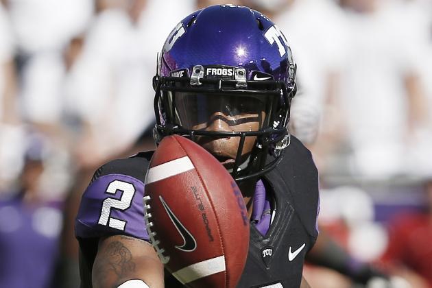 TCU quarterback Trevone Boykin (2) tosses the ball to a teammate during the first half of a NCAA college football game against Oklahoma at Amon G. Carter Stadium, Saturday, Oct. 4, 2014, in Fort Worth, Texas. TCU won 37-33. (AP Photo/Brandon Wade)