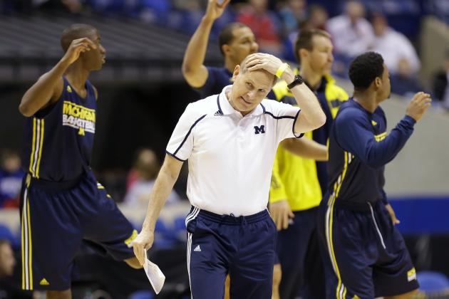 Michigan head coach John Beilein rubs his head during practice for their NCAA Midwest Regional semifinal college basketball tournament game Thursday, March 27, 2014, in Indianapolis. Michigan plays Tennessee on Friday, March 28, 2013. (AP Photo/Michael Conroy)