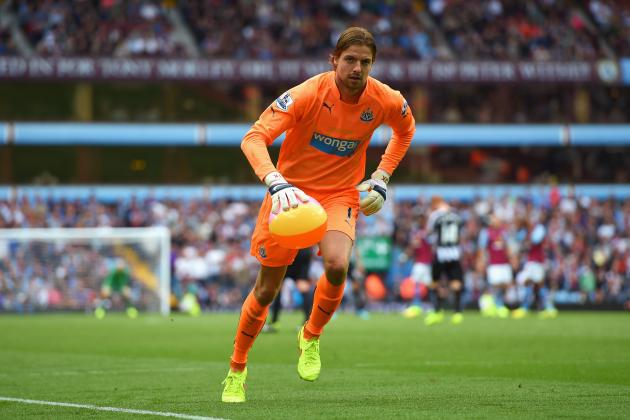 BIRMINGHAM, ENGLAND - AUGUST 23: Tim Krul of Newcastle United removes a beach ball from the pitch during the Barclays Premier League match between Aston Villa and Newcastle United at Villa Park on August 23, 2014 in Birmingham, England.  (Photo by Michael Regan/Getty Images)