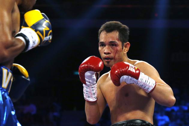 Simpiwe Vetyeka of South Africa, left, fights with Nonito