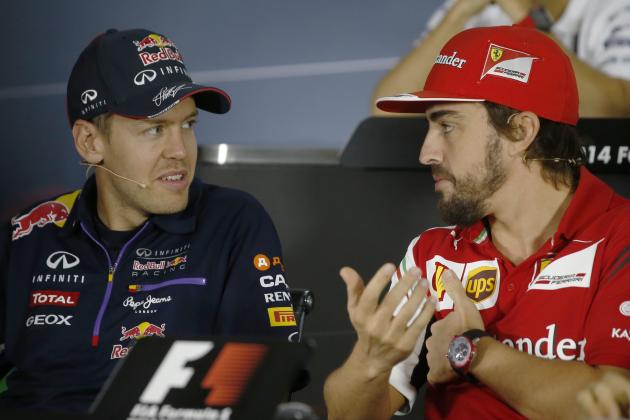 Ferrari driver Fernando Alonso of Spain, right, talks with Red Bull driver Sebastian Vettel of Germany during a news conference at the Sochi Autodrom Formula One circuit in Sochi, Russia, Thursday, Oct. 9, 2014. Formula One drivers say they will race this weekend's Russia Grand Prix for Jules Bianchi, who was seriously injured in an accident last week in Japan.Four-time defending Formula One champion Sebastian Vettel will leave Red Bull at the end of the season and is expected to soon announce a deal with Ferrari. The inaugural Russian GP will be held on Sunday in Sochi, the Black Sea resort that hosted this year's Winter Olympics. (AP Photo/Luca Bruno)