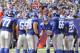 New York Giants quarterback Eli Manning (10) talks to his teammates in the huddle during the second half of an NFL football game against the Arizona Cardinals Sunday, Sept. 14, 2014, in East Rutherford, N.J. (AP Photo/Bill Kostroun)