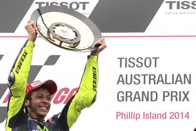 MotoGP rider Valentino Rossi of Italy raises his winners trophy as he celebrates after winning the Australian Motorcycle Grand Prix at Phillip Island, Australia,  Sunday, Oct. 19, 2014. Rossi won the race ahead of Jorge Lorenzo of Spain and Bradley Smith of Britain.(AP Photo/Rob Griffith)