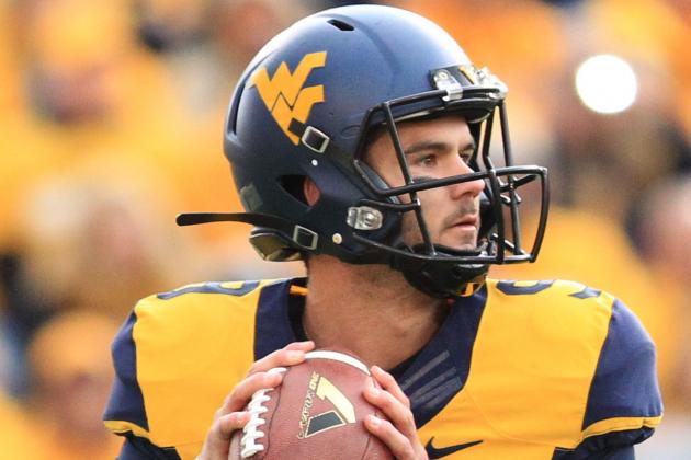 West Virginia quarterback Clint Trickett (9) looks for a receiver during the second quarter of their NCAA college football game against Kansas in Morgantown, W.Va., Saturday, Oct. 4, 2014. West Virginia won 33-14. (AP Photo/Chris Jackson).