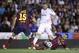 Barcelona's Javier Mascherano, right, shields the the ball from Real's Karim Benzema, centre during the final of the Copa del Rey between FC Barcelona and Real Madrid at the Mestalla stadium in Valencia, Spain, Wednesday, April 16, 2014. (AP Photo/Alberto Saiz)