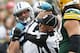 Carolina Panthers' Luke Kuechly is confronted by back judge Steve Freeman during the second half of an NFL football game against the Green Bay Packers Sunday, Oct. 19, 2014, in Green Bay, Wis. Kuechly was ejected from the game. (AP Photo/Mike Roemer)