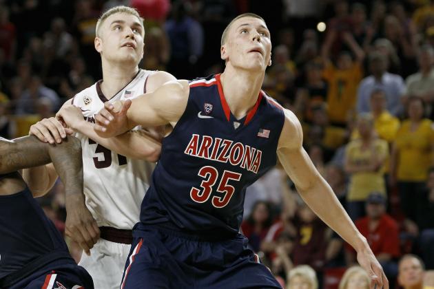 TEMPE, AZ - FEBRUARY 14:  Kaleb Tarczewski #35 of the Arizona Wildcats and Jonathan Gilling #31 of the Arizona State Sun Devils battle for position under the basket during the second half of a college basketball game at Wells Fargo Arena on February 14, 2014 in Tempe, Arizona.  (Photo by Ralph Freso/Getty Images)
