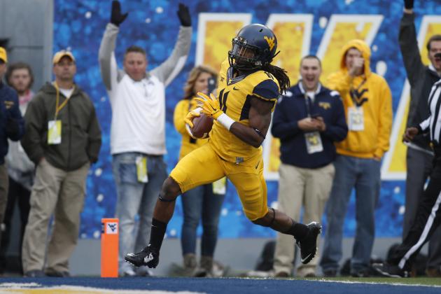 Oct 4, 2014; Morgantown, WV, USA; West Virginia Mountaineers wide receiver Kevin White (11) crosses the goal line to score a touchdown against the Kansas Jayhawks during the first quarter at Milan Puskar Stadium. Mandatory Credit: Charles LeClaire-USA TODAY Sports