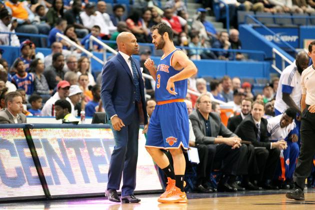 HARTFORD, CT - OCTOBER 8: Head coach Derek Fisher and Jose Calderon #3 of the New York Knicks speak during the game against the Boston Celtics during a preseason game at the XL Center on October 8, 2014 in Hartford, Connecticut. NOTE TO USER: User expressly acknowledges and agrees that, by downloading and or using this photograph, User is consenting to the terms and conditions of the Getty Images License Agreement. (Photo by Ned Dishman/NBAE via Getty Images)