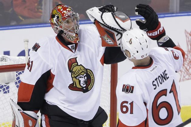Ottawa Senators goalie Craig Anderson (41) and right wing Mark Stone (61) celebrate after the Senators defeated the Florida Panthers 1-0 in an NHL hockey game, Monday, Oct. 13, 2014 in Sunrise, Fla. (AP Photo/Wilfredo Lee)