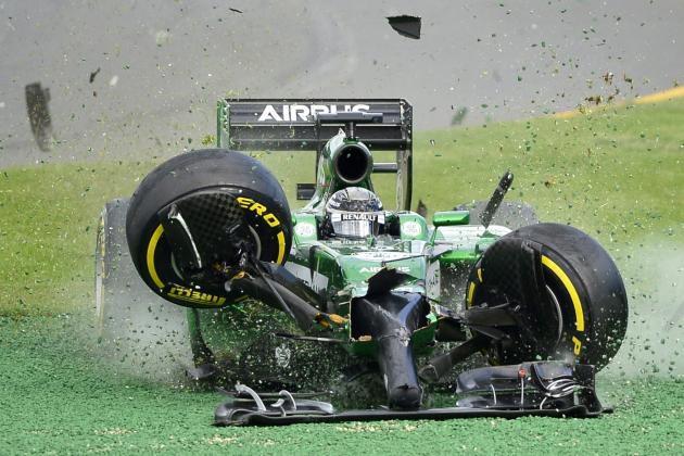 Caterham driver Kamui Kobayashi of Japan runs off the track after he collided with Williams driver Felipe Massa of Brazil at the start of the Australian Formula One Grand Prix at Albert Park in Melbourne, Australia, Sunday, March 16, 2014. Massa and Kobayashi walked away uninjured from the accident. (AP Photo/Ross Land)